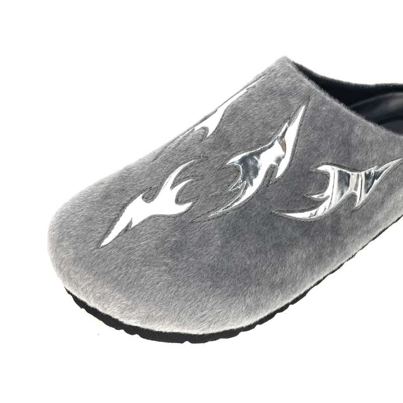 Close-up of silver flame patch on grey faux fur clog custom footwear manufacturer