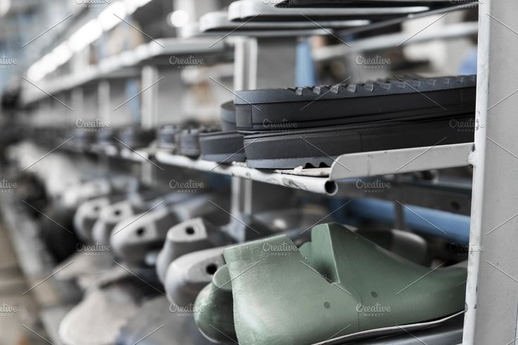 The conveyor on a shoes factory with featuring factory, production, and (1)